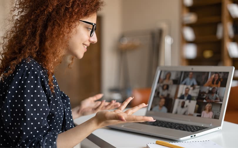 Image of a man working on his fruit stall, smiling at the camera.
